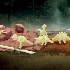 Roca con dinosaurio resplandeciente